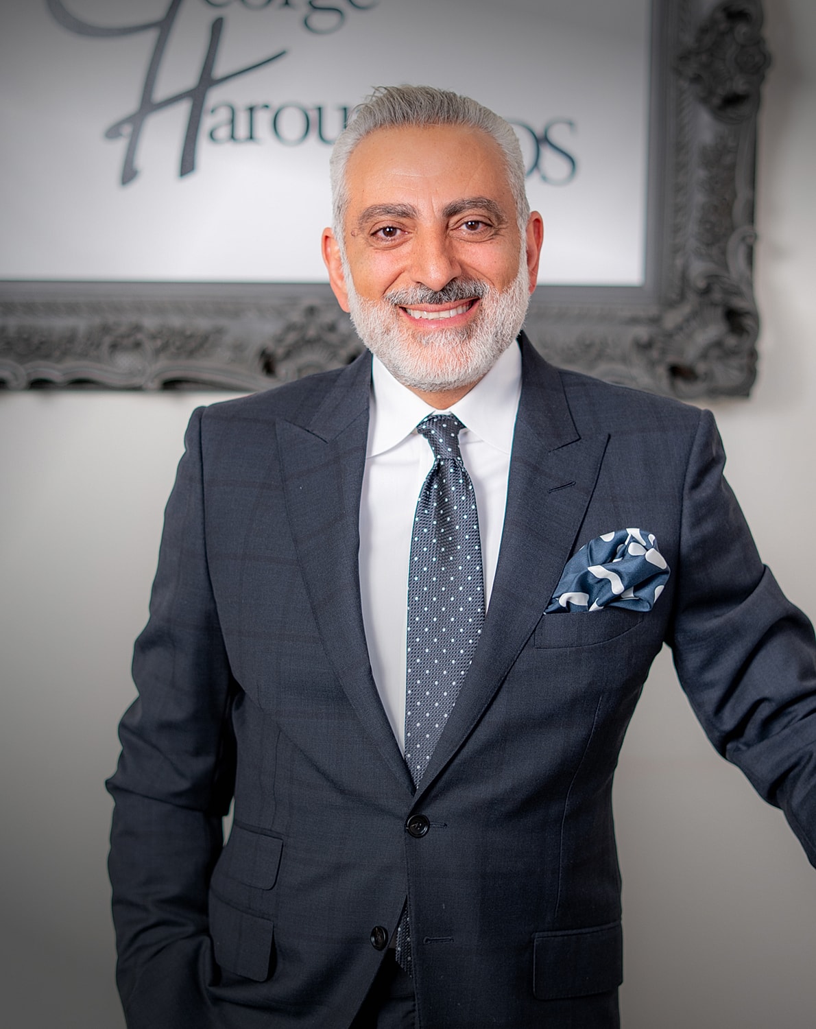 Professional man in suit smiling confidently.