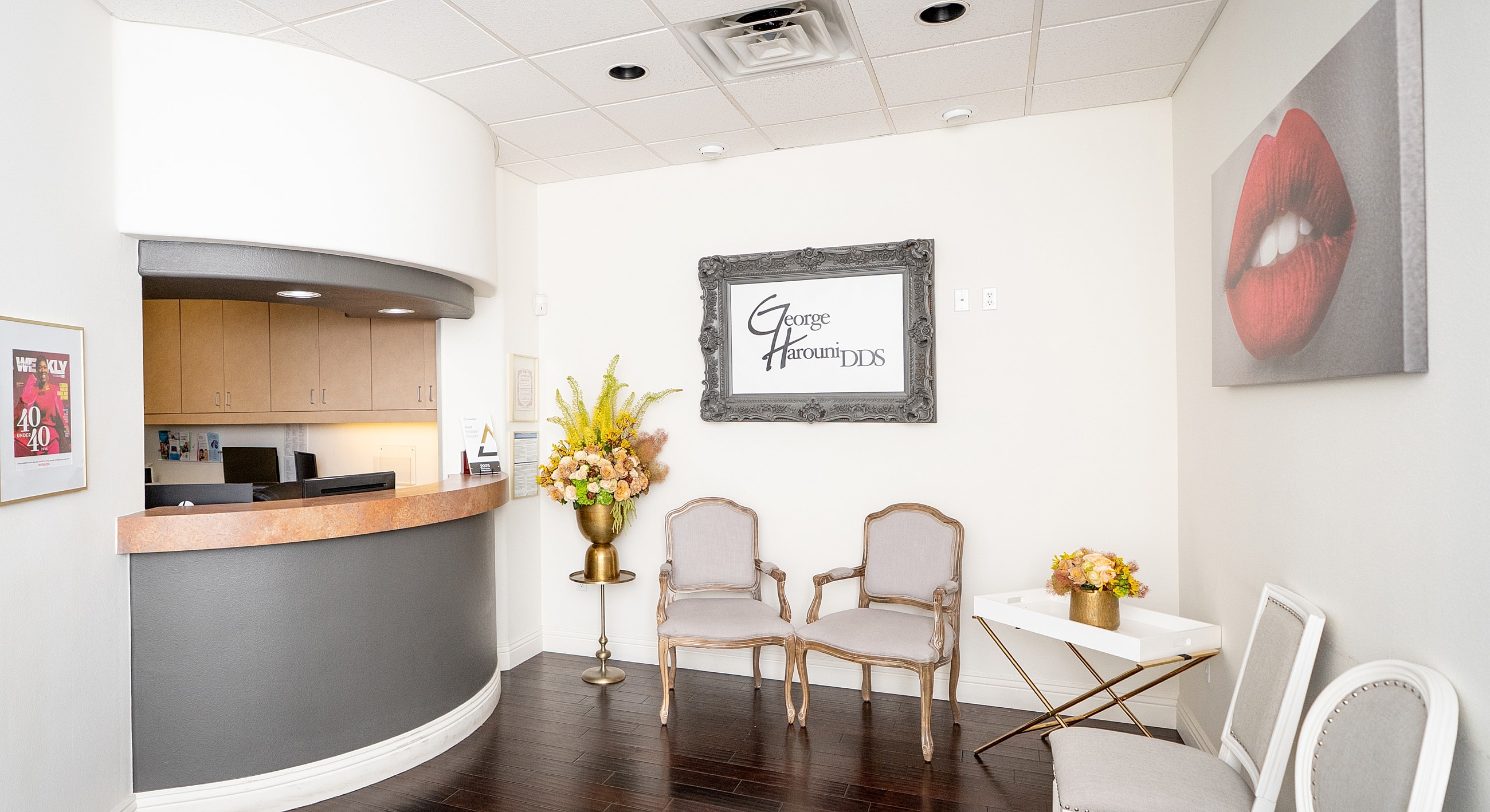 Dental office reception area with seating.