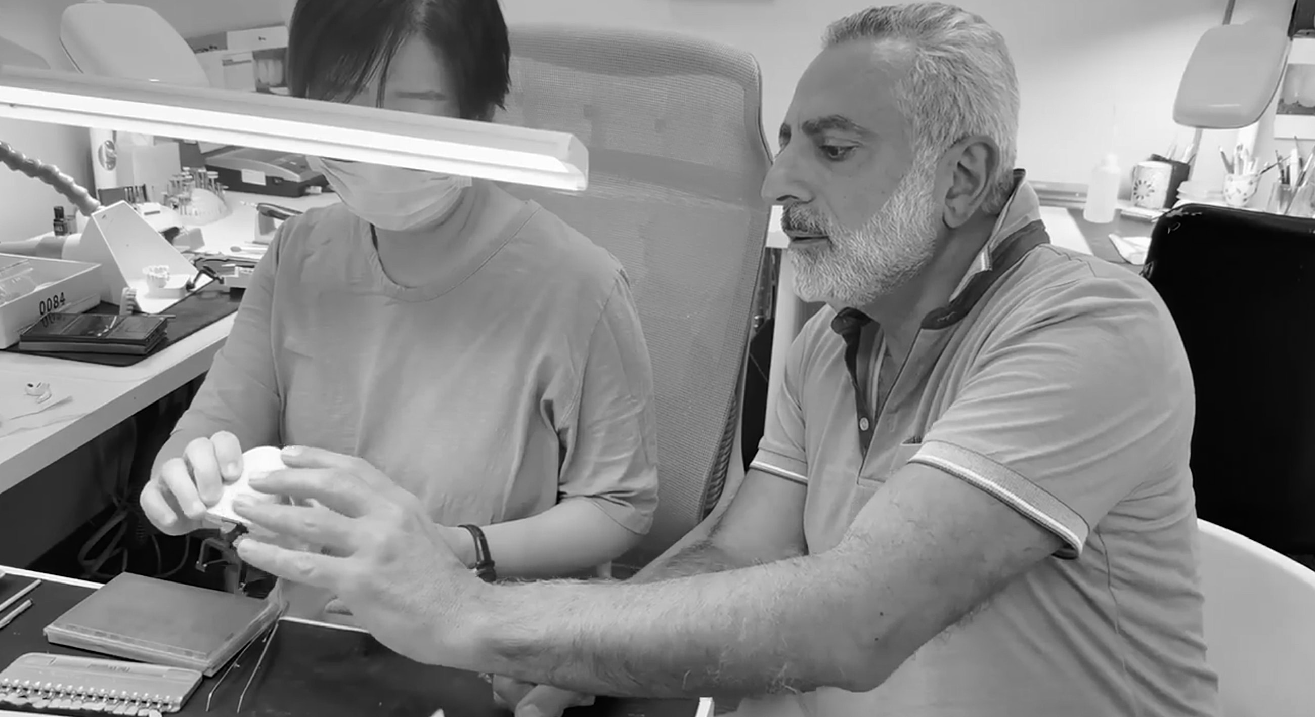Two people working in a salon setting.