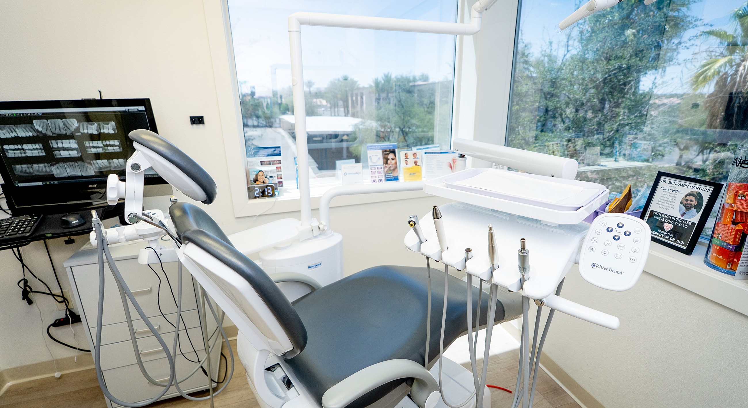 Dental office equipped with chair and monitor.