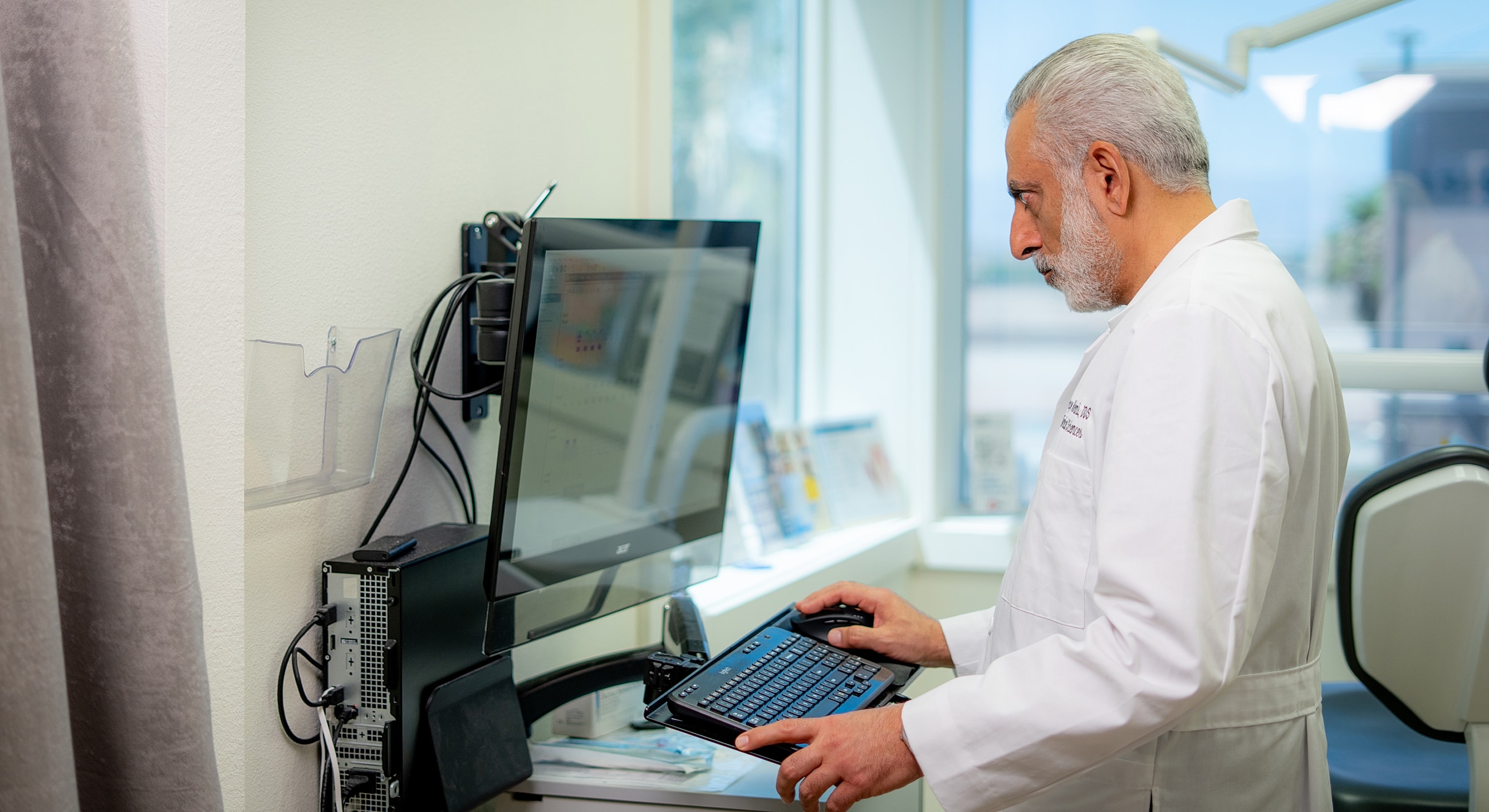 Doctor using a computer in a medical office.